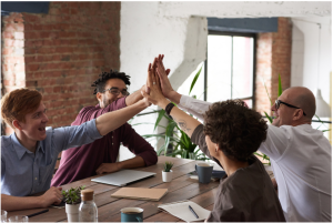 A group of people working together in a meeting room