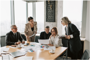 A group of people in a business meeting